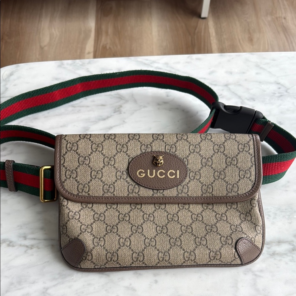 Gucci Brown Crossbody Bag with Iconic Monogram and Adjustable Strap